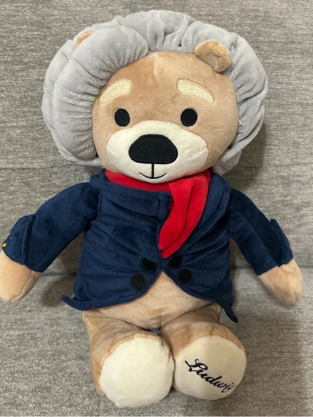 Plush Lion in Navy Jacket with Red Scarf
